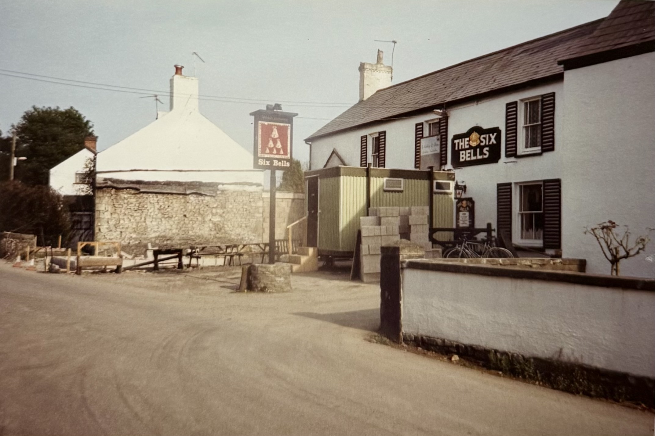 Outside the front of the pub, where the restaurant now stands. The portakabin stands directly in front of the front door.