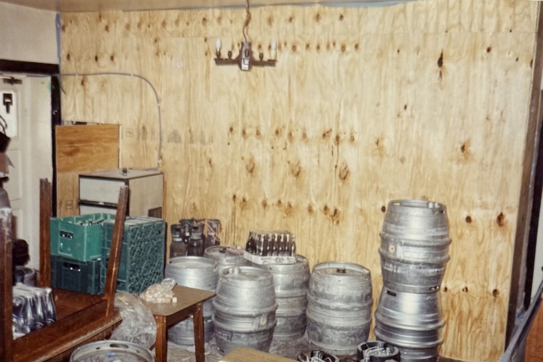 Another cellar area, with a makeshift wooden wall behind. The location in which the photo was taken is unclear.