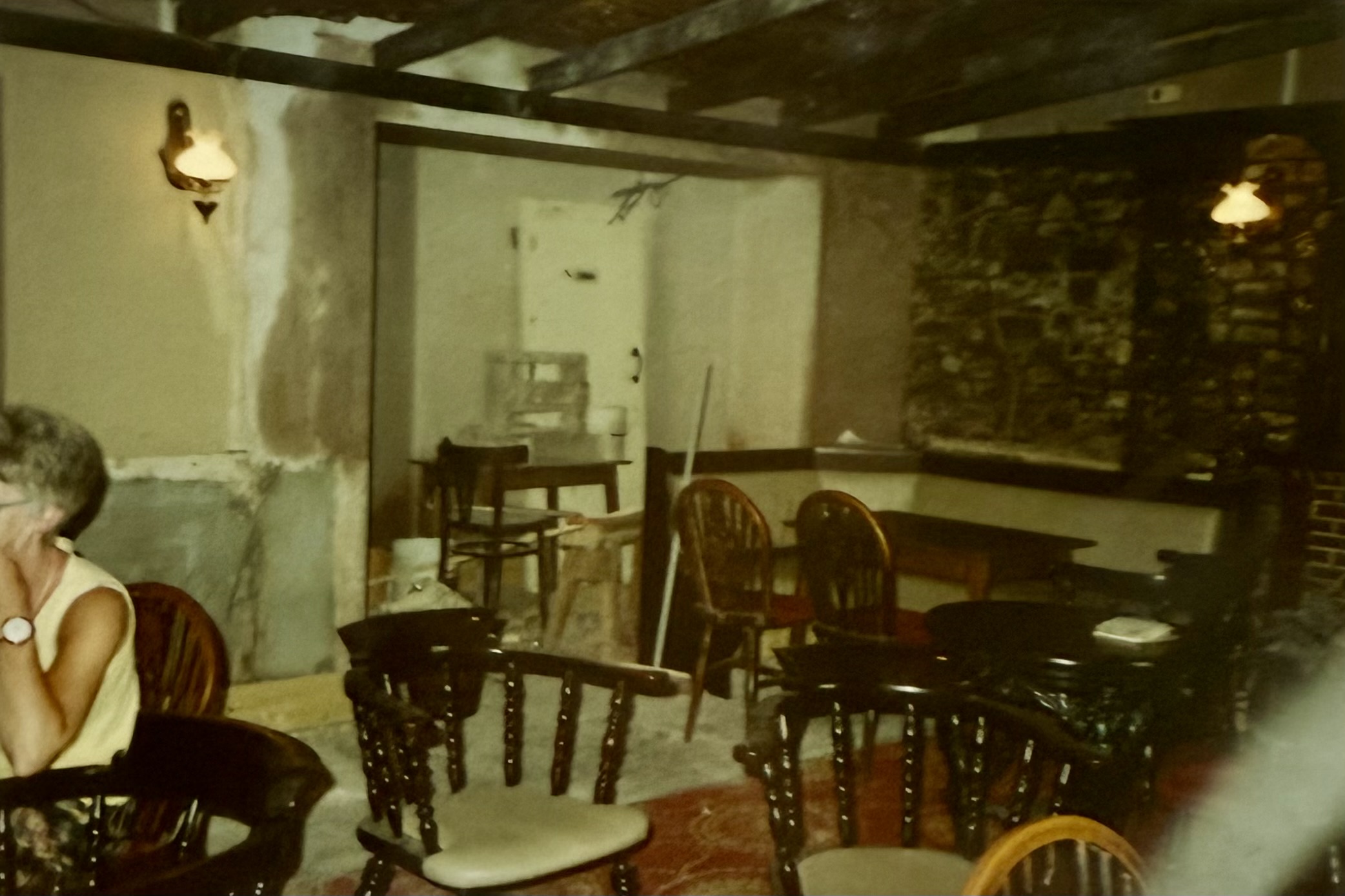 The same area as above, but now during renovations - frames and dartsboards have been taken off the walls which appear to have been recently plastered.