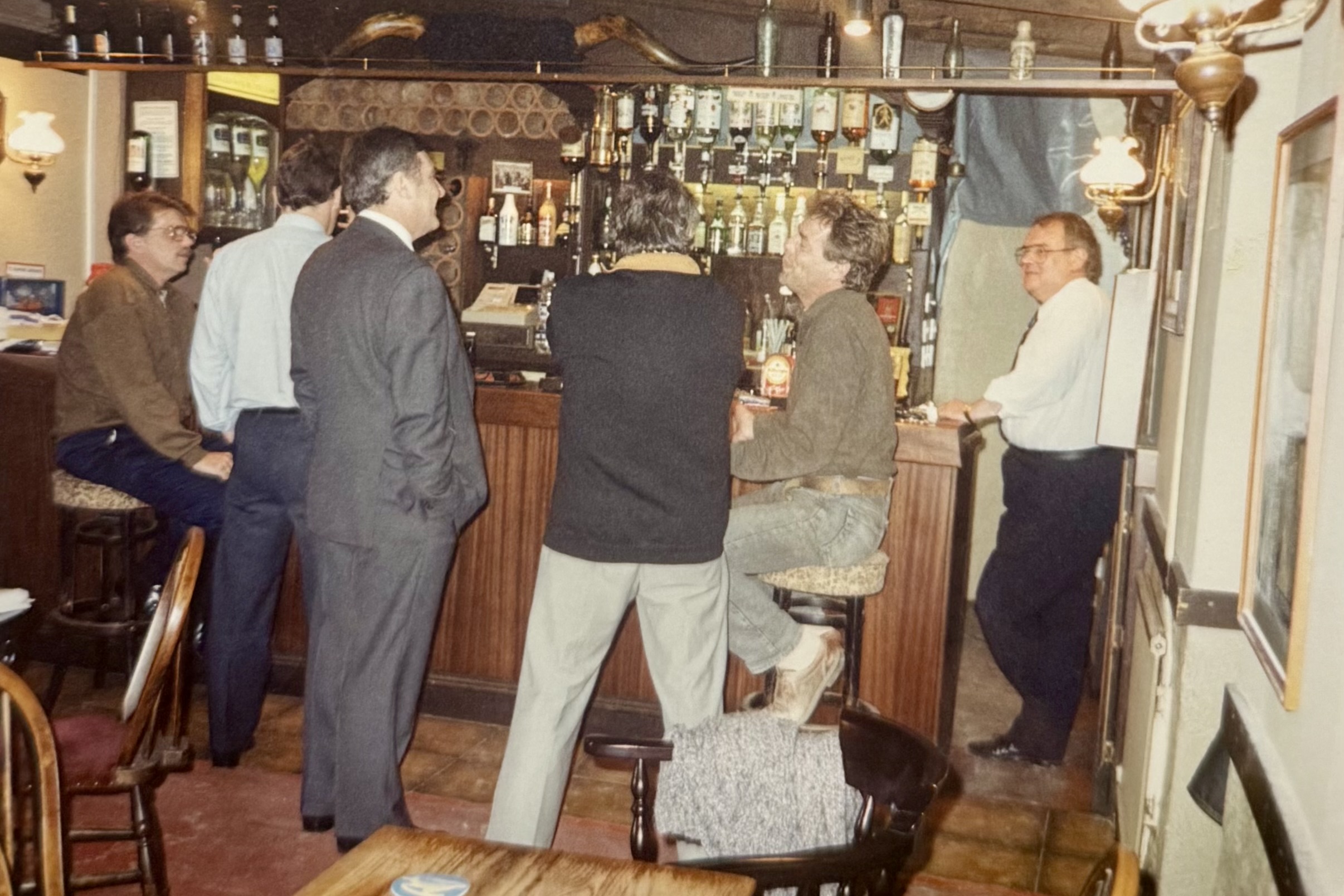 People stood at the bar on the Bar side, with Arthur Marsh stood by the bar hatch which is no longer in use.