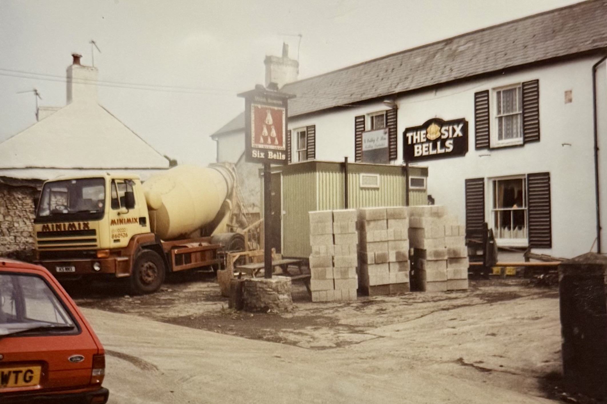 A different construction vehicle (Minimix written on the side), near the portakabin which was on the front door and some breeze blocks which would later be used to build the restaurant.