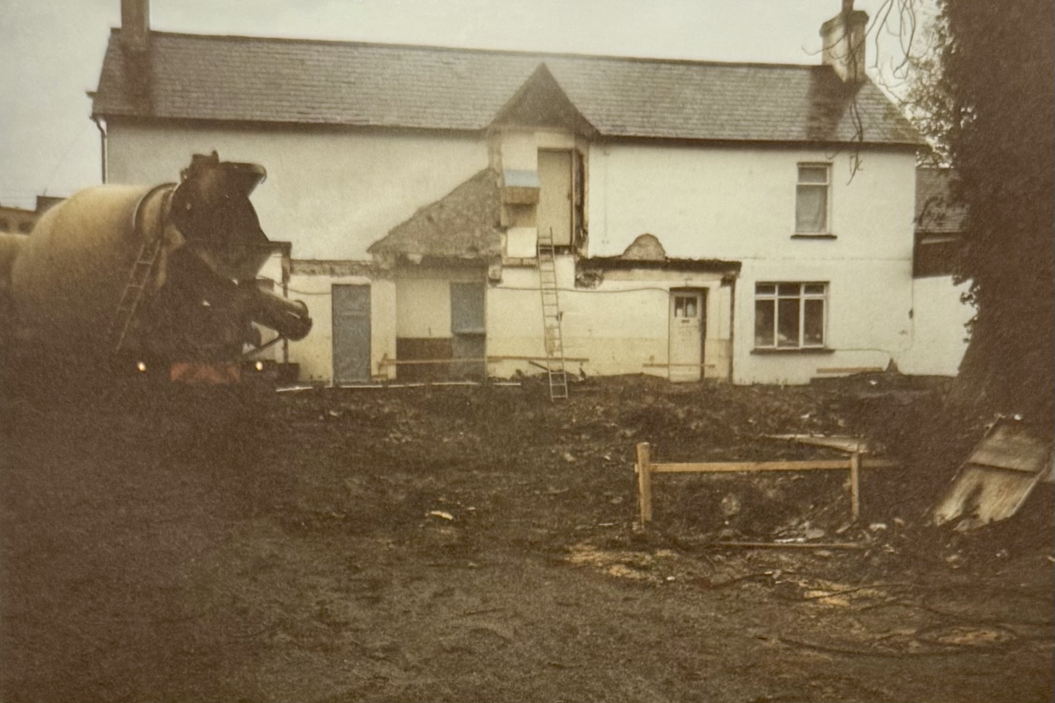 The pub from behind, during the renovations. Parts of the building have been removed, exposing some inside doors, and there's a large trench that's been dug out ready for the construction of the Function Room. You can also see the window which was once in the Lounge but was lost to the renovations.