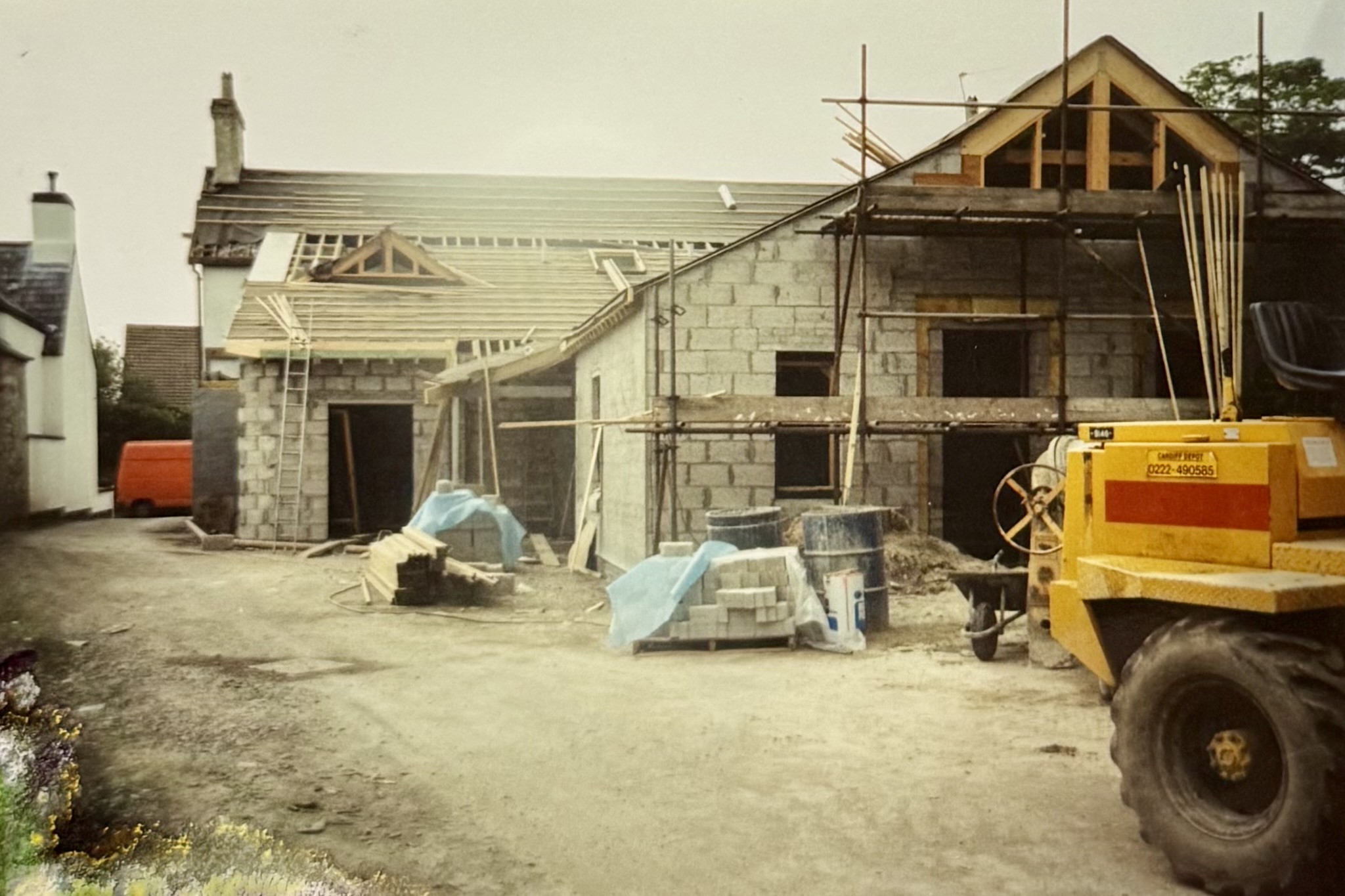 Things starting to come together - the roof is still being constructed but you can see the upstairs bathroom window and the main structure of the roof has been placed.