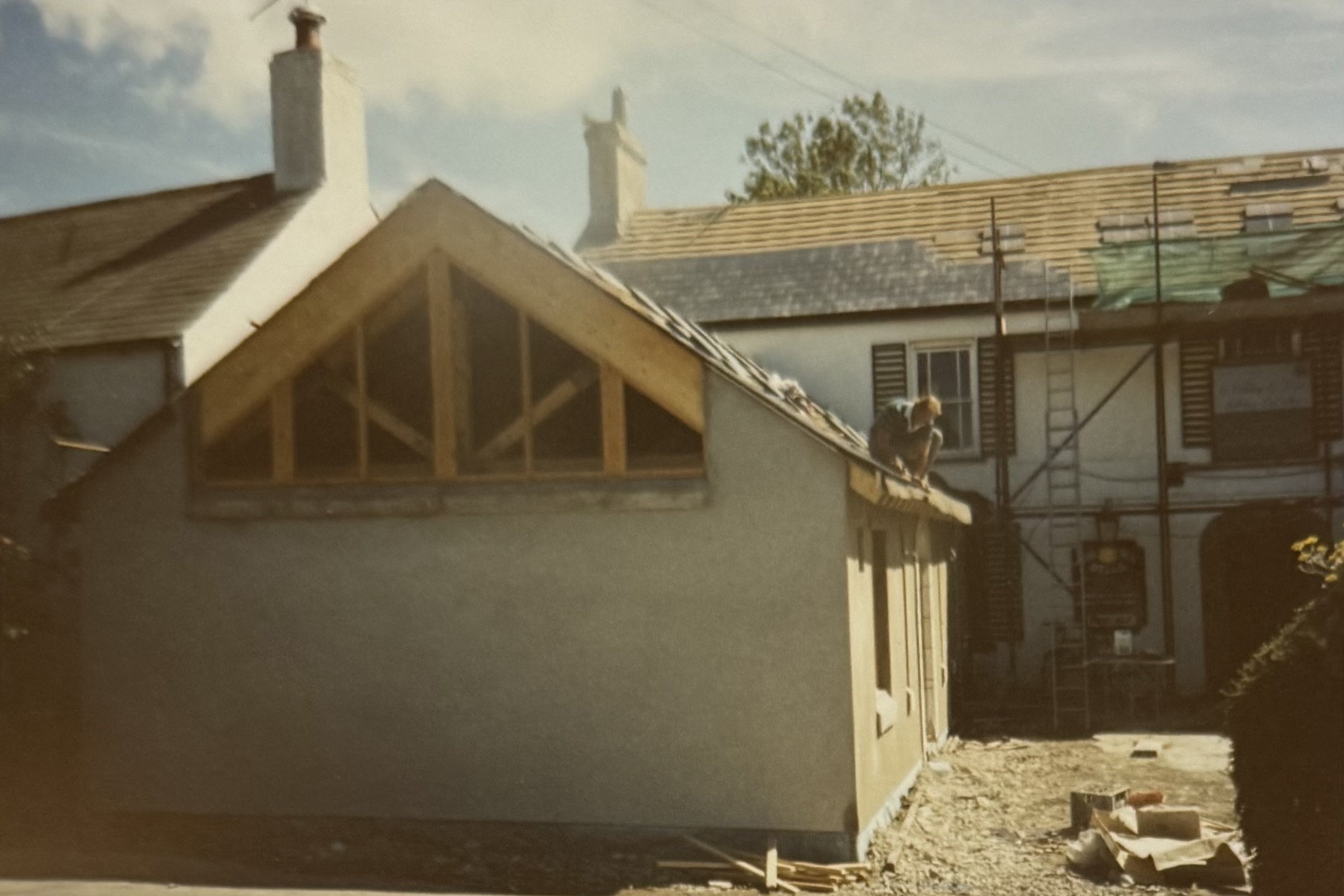 The window at the back of the Restaurant area from the front of the pub. You can see tiles are being placed on the roof in the background.