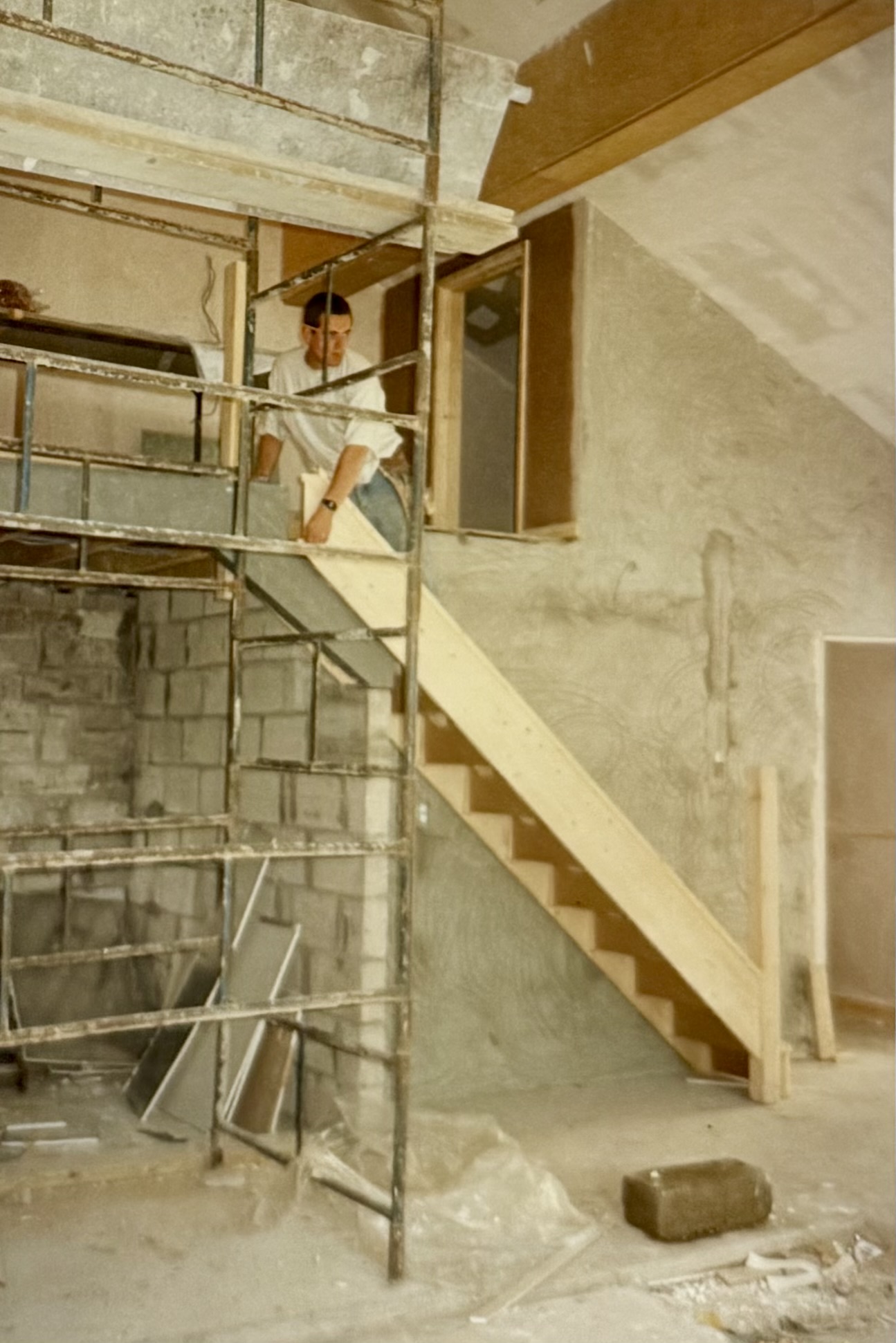 A man working on the stairs which lead up to the Gallery above the Function Room.